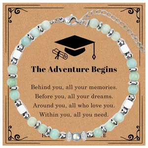 Graduation beaded bracelet with moonstone and African pine beads on a gift card.