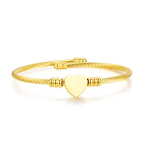 Elegant gold titanium steel cable bracelet with smooth heart charm and ribbed beads