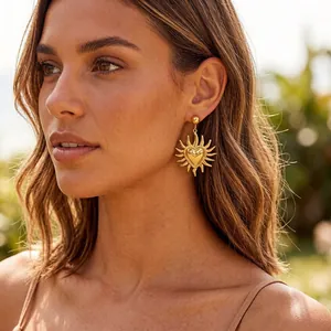 Vintage 18K gold plated sunflower heart drop earrings worn by a model in sunlight