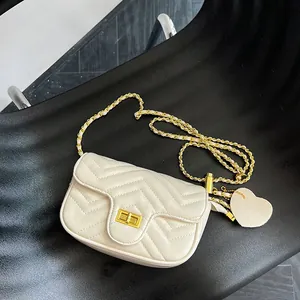 Chic beige chevron quilted chain crossbody bag with golden hardware and heart charm