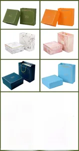 Detail of luxury corporate gift boxes in six colors with gold ribbons and Good Luck text