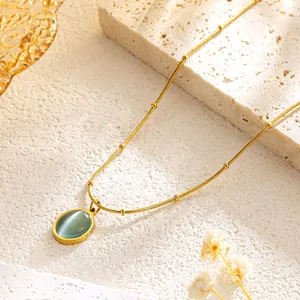 Golden titanium steel ball chain necklace with an oval blue cat's eye gemstone pendant