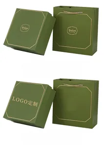 Dark green business gift box and matching carry bag with elegant gold foil lettering