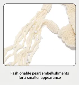 Detailed macro view of cream handmade crochet knit texture with elegant pearl beads