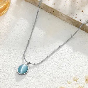 Elegant titanium steel necklace featuring an oval light blue cat eye stone on a silver beaded chain