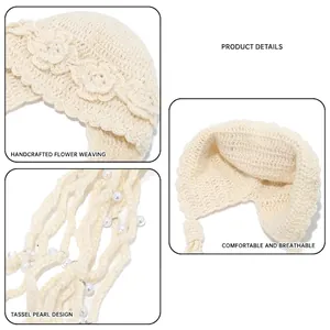 Handmade crochet beanie with woven floral detail and white pearl tassel fringe