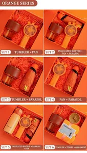 Detail of orange business gift sets including coffee mug, fan, umbrella and thermos