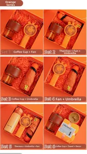 Detail of orange business gift sets including coffee mug, fan, umbrella and thermos