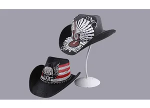 Close-up of black straw cowboy hats with skull, wing, and guitar printed patterns