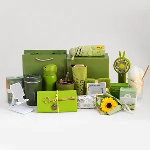 Green business gift set including thermal coffee cup, water bottle, umbrella, and mini fan