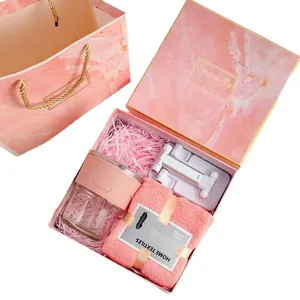 Pink business gift set with glass mug, face towel and phone holder in marble box