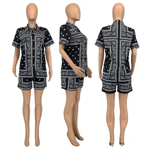 Three-view display of black paisley print short sleeve shirt and shorts set