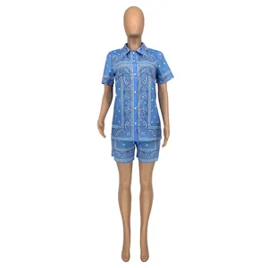 Close-up of blue and white paisley print short sleeve shirt and high-waist shorts set