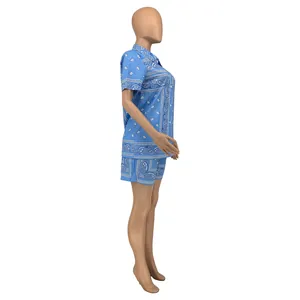 Side view of sky blue two-piece summer set with white paisley and polka dot prints