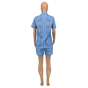 Back view of women's two-piece casual set featuring blue paisley print shorts and shirt