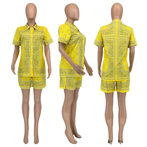 Detailed views of yellow paisley print short sleeve shirt and shorts summer set