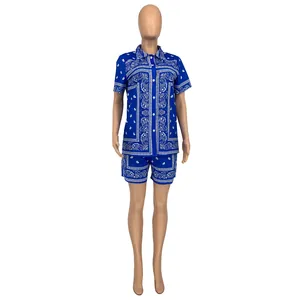 Detailed close-up of navy blue paisley print on women's casual two-piece shirt and shorts set