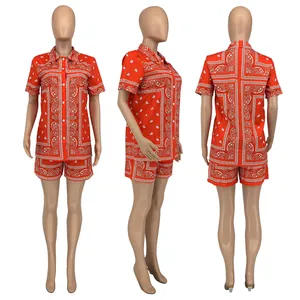 Three-view display of orange paisley print shirt and shorts set with elastic waist