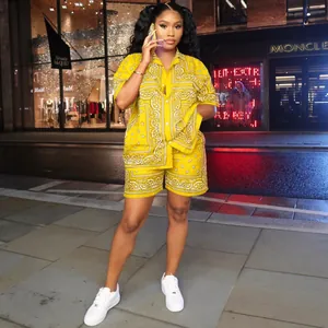 Vibrant yellow two-piece women's paisley print shirt and shorts set street style
