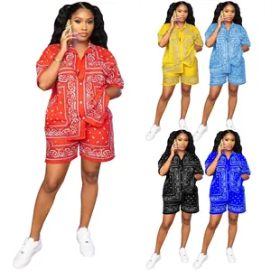 Women's summer two-piece outfit featuring short sleeve paisley print shirt and shorts