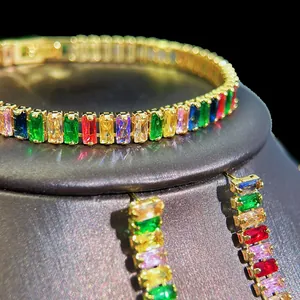 Detailed view of rainbow zircon jewelry set with gold finish and rectangle cut crystals