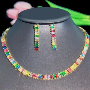 Rainbow baguette-cut zircon necklace and earrings jewelry set on a black display stand