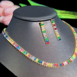 Detail of colorful rectangular cut zircon jewelry set with gold necklace and drop earrings