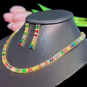 Detail of rainbow zircon jewelry set with gold necklace and matching drop earrings
