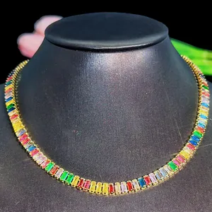 Detailed macro view of rainbow baguette-cut zircon stones on a gold-plated necklace
