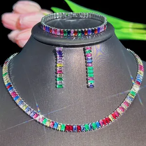 Rainbow gemstone jewelry set with necklace, bracelet and earrings on a black bust