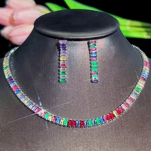 Macro detail of rainbow zircon jewelry set featuring rectangle cut colorful stones