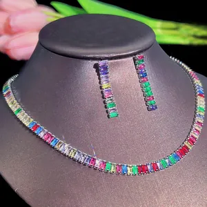 Macro shot of rainbow zircon necklace and drop earrings set in silver claw setting