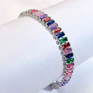 Macro view of silver tennis bracelet with colorful rectangular-cut zircon stones