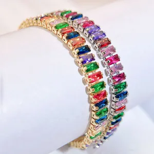 Detailed macro view of gold and silver tennis bracelets with colorful zircon stones