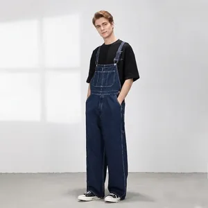 Salopette en jean bleu foncé coupe droite ample avec poches classiques et style high-street