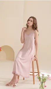 Detail of soft cotton nightgown featuring ruffled V-neckline and breathable knit texture