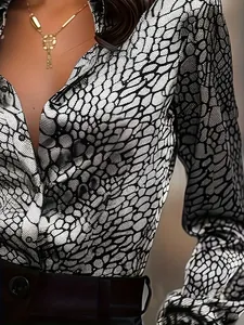 Elegant slim fit long sleeve shirt for women featuring a monochrome snakeskin print