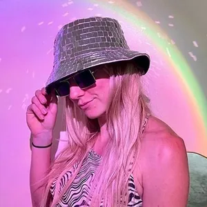 Close-up of shiny silver mirror disco bucket hat with reflective glass square tiles