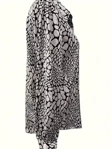 Elegant slim-fit long-sleeve blouse featuring black and white snake-skin pattern print
