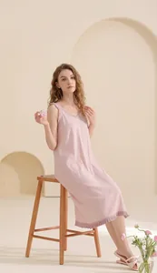 Close-up of pink cotton nightgown showing pleated texture and delicate lace trim
