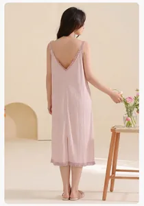 Detail of the elegant deep V-back design and ruffle hem on the cotton pink nightdress