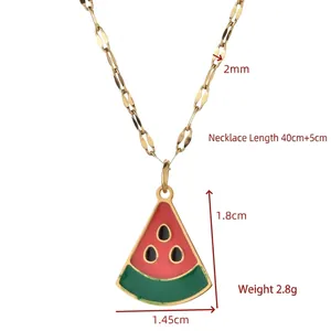 Minimalist gold watermelon slice pendant necklace with red enamel and green rind detail