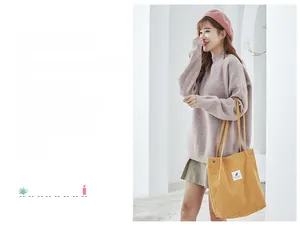 Detail of ginger corduroy tote bag with square fabric label for autumn fashion