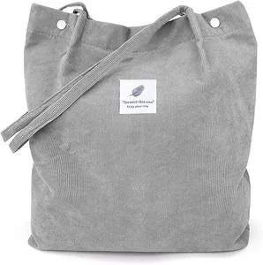 Gray corduroy tote bag with adjustable strap and vintage label, 2025 casual style