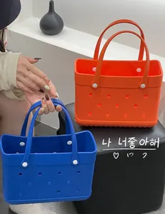 Close-up of lightweight orange and blue EVA tote bags featuring a perforated beach design