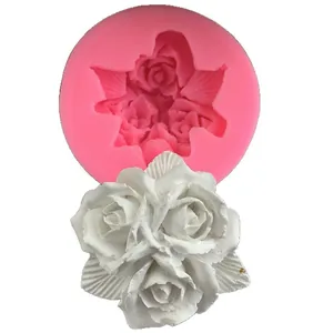 Detailed pink silicone mold with 3-rose pattern and finished white plaster flower cast