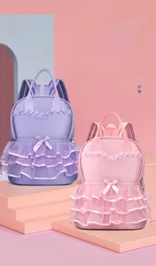 Cute purple and pink kids dance backpacks with lace ruffles and elegant bow accents