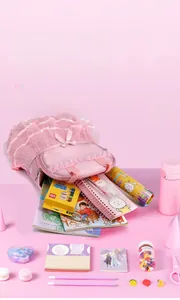 Pink girl's dance backpack showing large capacity with school supplies and lace detail