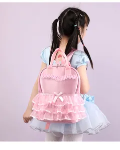 Pink ruffled backpack for toddler girls showing back view detail on little girl model