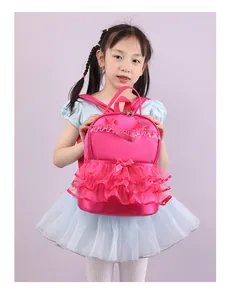Detailed view of a bright pink nylon school backpack with lace ruffles for girls.